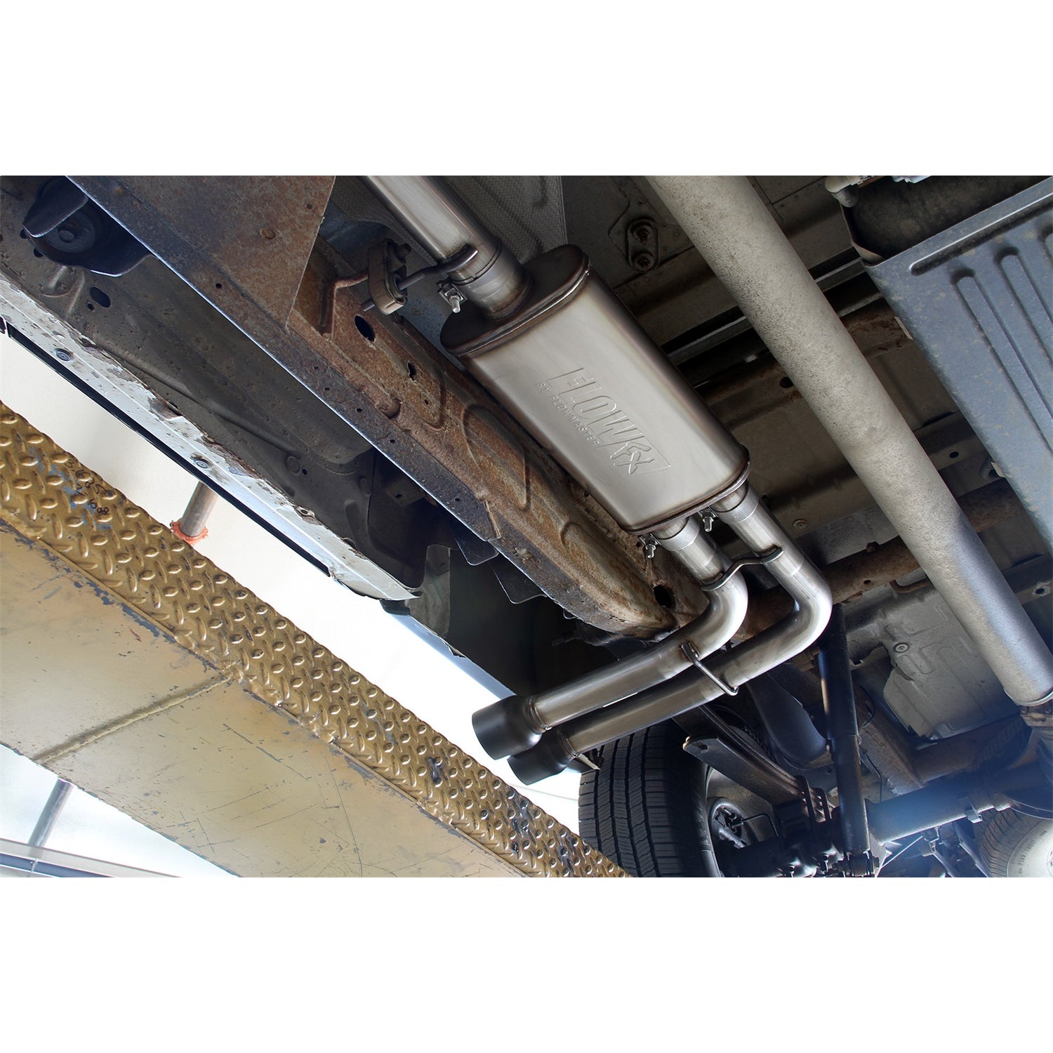 Flowmaster FlowFX Exhaust System - Cat-Back - 2-1/2" Diameter - Side Exit - Dual 4" Black Tips - Stainless